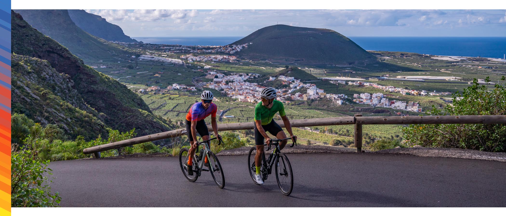 Two Luxa cyclists navigate a winding road on the beautiful island of Tenerife, with stunning scenery all around. Ready for any challenge, their high-performance gear provides comfort and style for a ride to remember